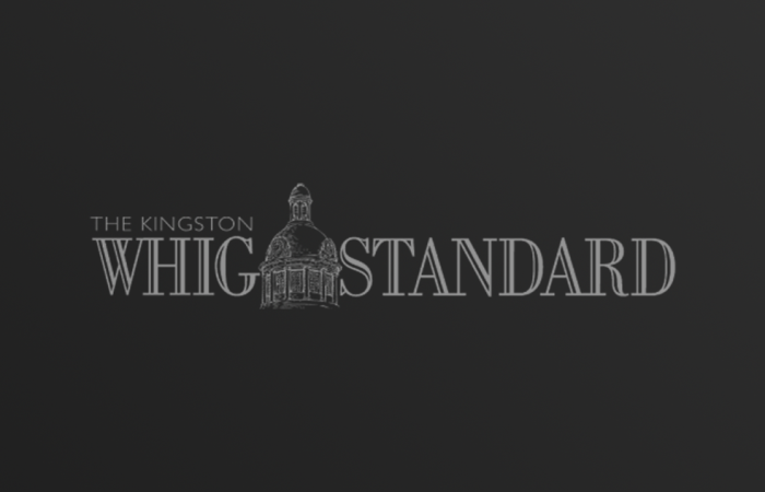 The Kingston Whig Standard logo on dark gradient background