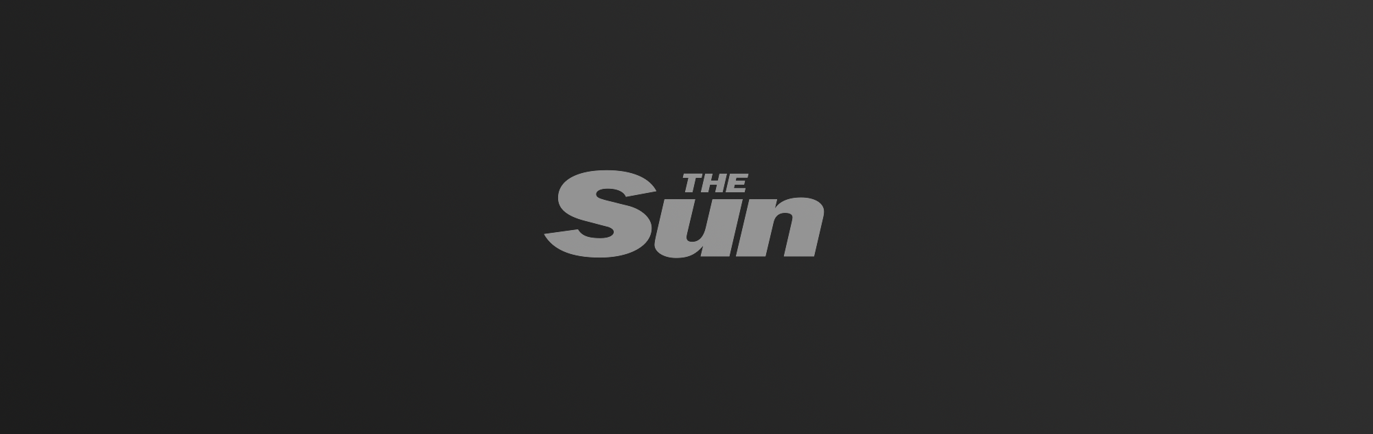 The Sun logo on dark gradient background