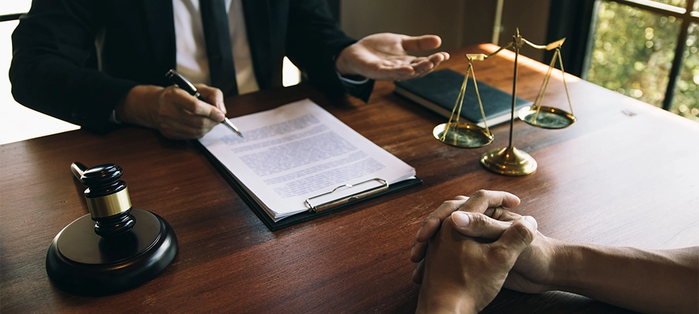 client is explaining the offense to the lawyer and working together to solve the problem of the offense