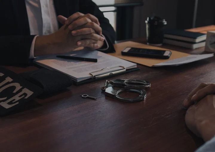 Tense situation at the inquiry room where police officers and the accused are talking