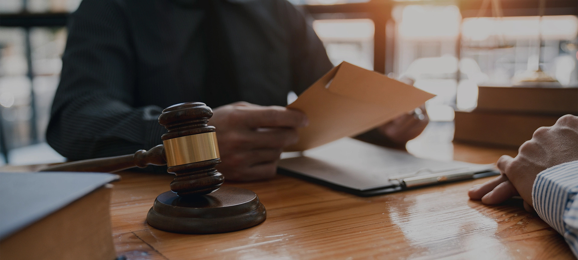 lawyer or attorney who is taking bribes reads the statute of limitations. Consultation between male lawyers and business clients, tax and legal services and corruption firms.