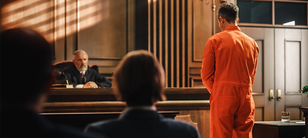 Court of Law and Justice Trial Proceedings: Law Offender in Orange Jumpsuit is Questioned and Giving Testimony to Judge, Jury. Criminal Denying Charges, Pleading, Inmate Denied Parole.