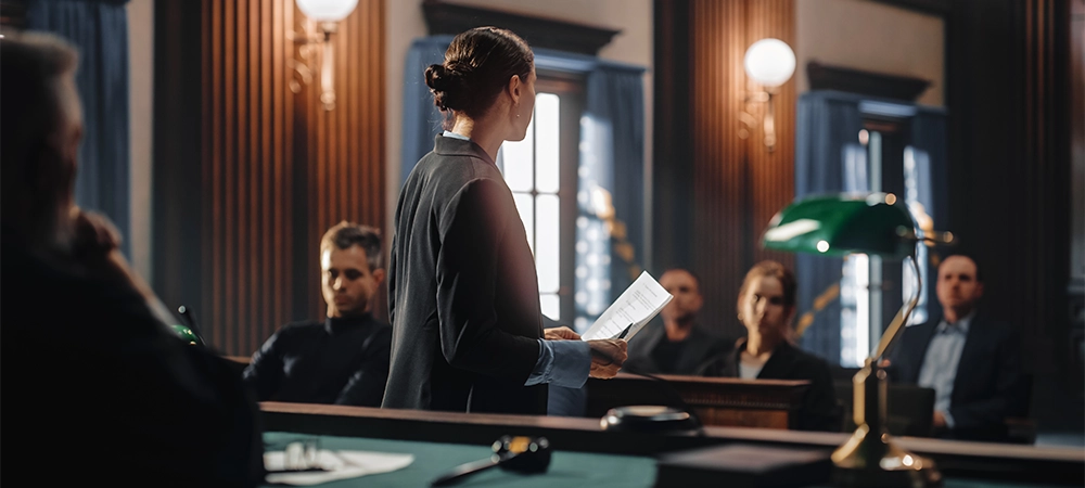 Court of Justice and Law Trial: Female Public Defender Presenting Case, Making Passionate Speech to Judge, Jury. Multiethnic Attorney Lawyer Protecting Client's Innocents with Supporting Evidence.