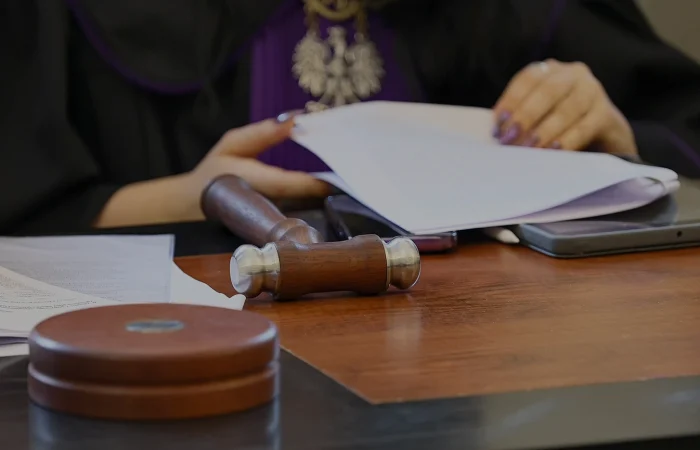 Judge's chain. The trial in Polish court, the insignia of law, lies on the bench.