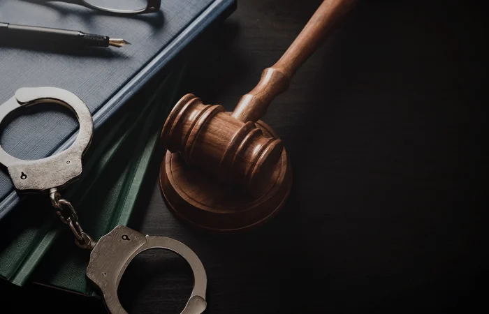 Handcuffs and wooden gavel. Crime and violence.